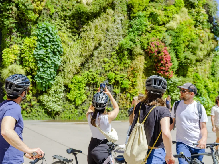 Private Madrid Bike Tour 7 Cyclists photograph the CaixaForum vertical garden wall on a private Madrid bike tour