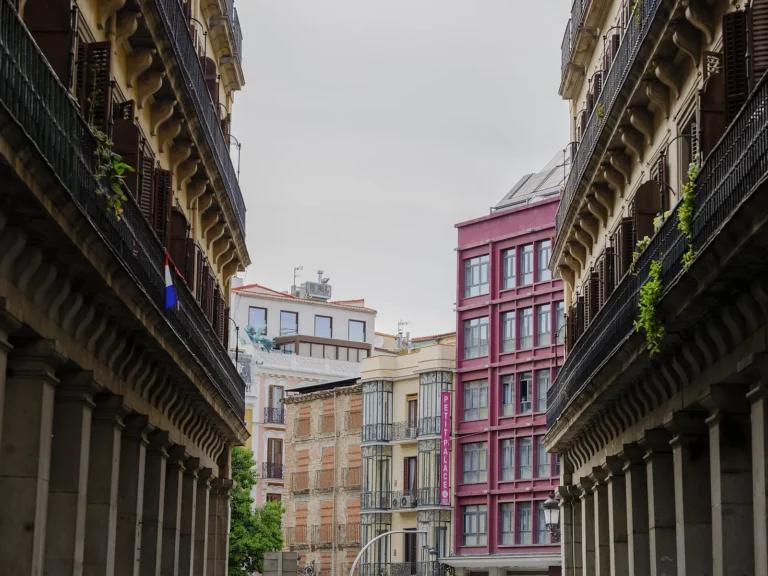 Private Madrid walking tour 6 View framed by the Plaza Mayor arcade columns toward central Madrid on a private Madrid walking tour