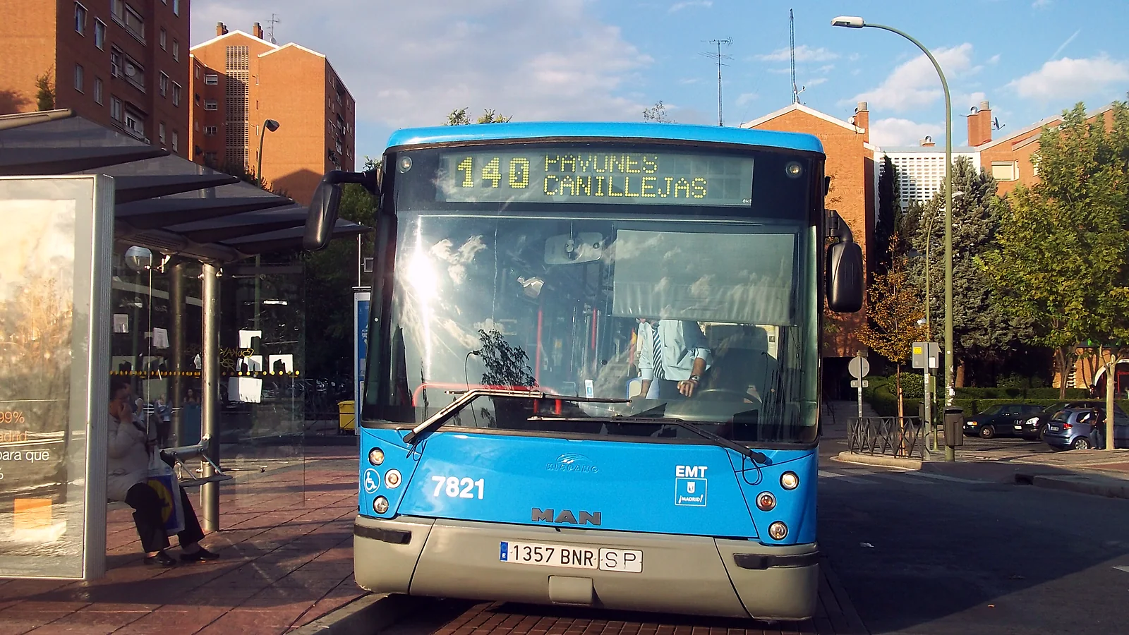 madrid airport to madrid centre 3 A blue EMT city bus waiting at a stop in Madrid