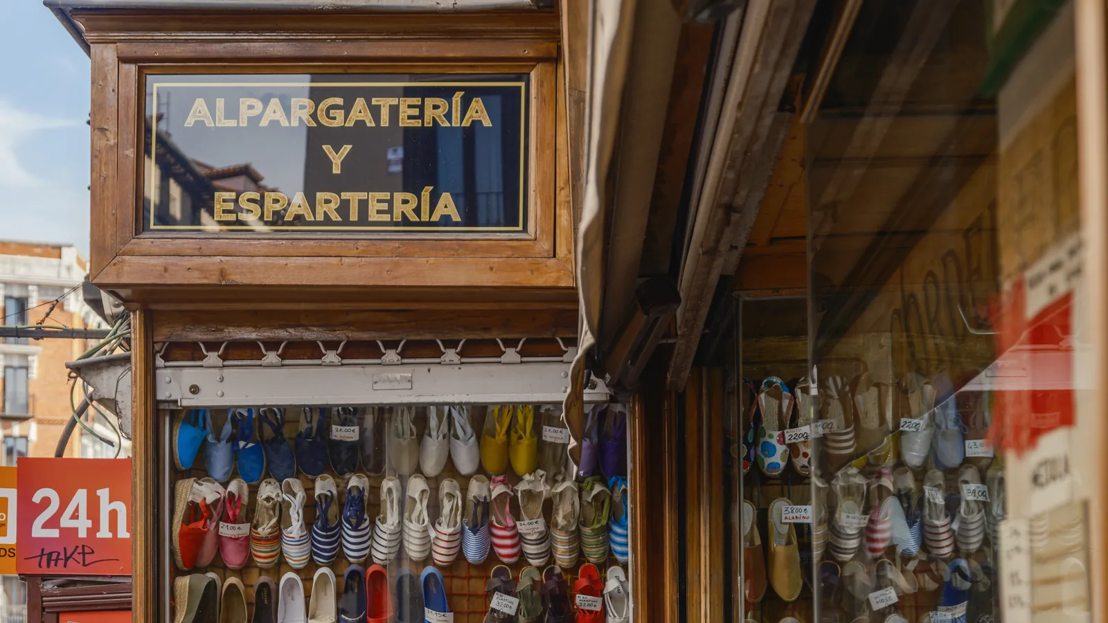 madrid souvenirs 1 Espadrilles in every colour in the window of a traditional alpargatería in central Madrid, under a sign reading Alpargatería y Espartería